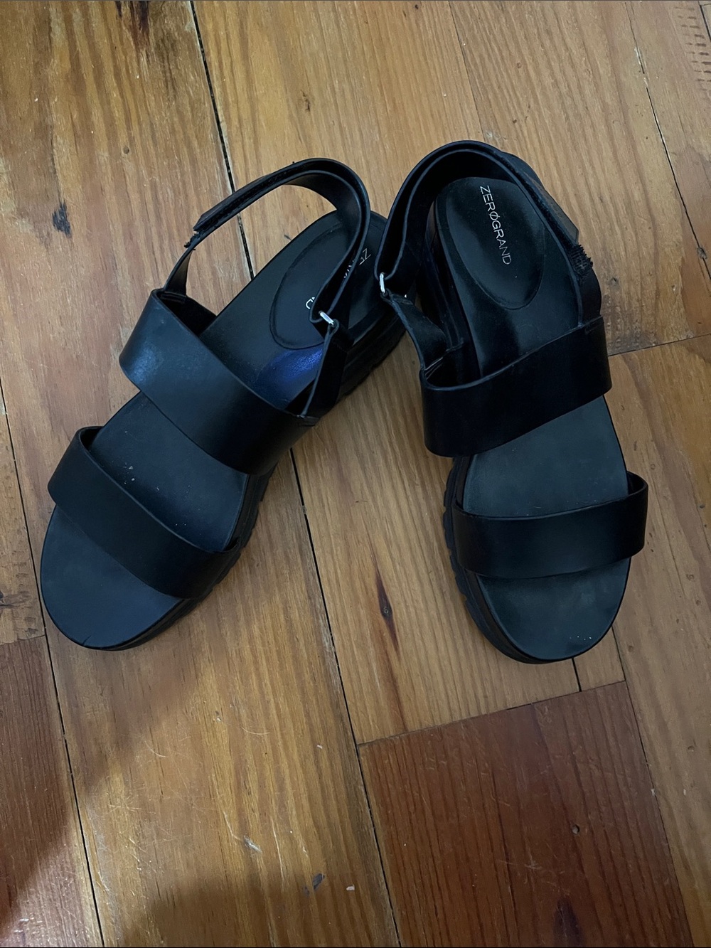 Black Cole Haan sandals with two straps across instep ,adjustable strap in back